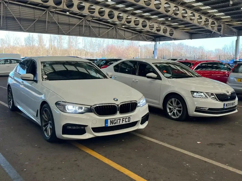 Two White BMW Cars Parked